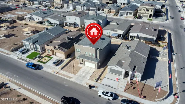 an aerial view of residential houses with outdoor space