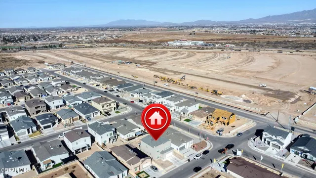 an aerial view of residential houses and outdoor space