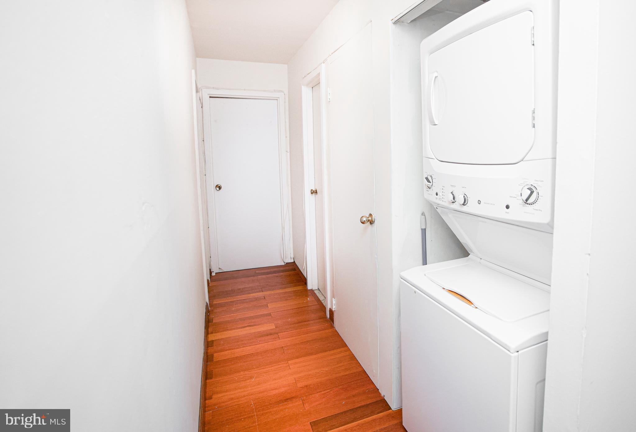 4000 Gypsy Lane, Unit 110C Philadelphia, PA 19129 - Photo 11 of 25 a view of a hallway with washer and dryer