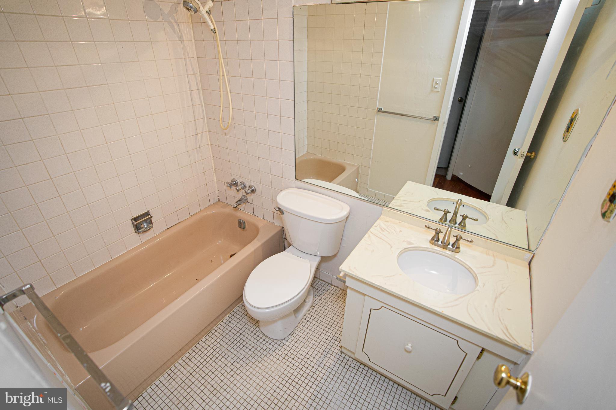 4000 Gypsy Lane, Unit 110C Philadelphia, PA 19129 - Photo 19 of 25 a bathroom with a sink toilet and shower