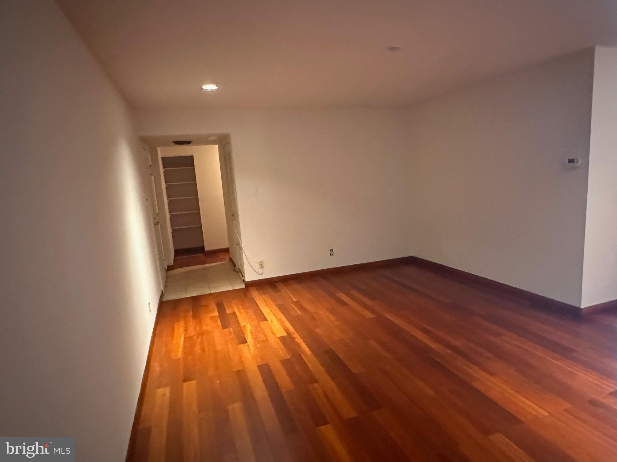 4000 Gypsy Lane, Unit 110C Philadelphia, PA 19129 - Photo 6 of 25 wooden floor in an empty room with a window