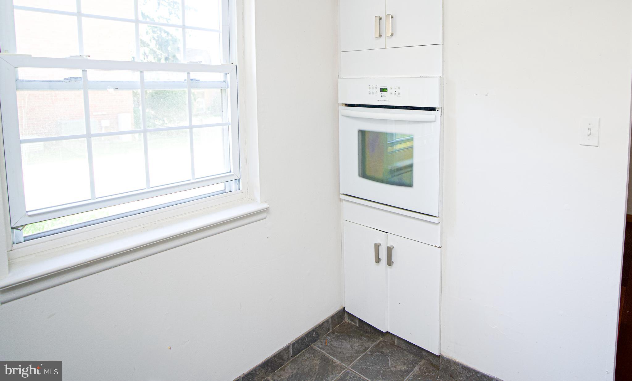 4000 Gypsy Lane, Unit 110C Philadelphia, PA 19129 - Photo 7 of 25 a view of a kitchen that has a window in it