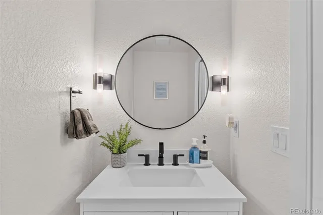 a bathroom with a sink and a mirror