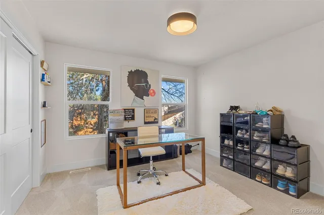 a work room with furniture and a window