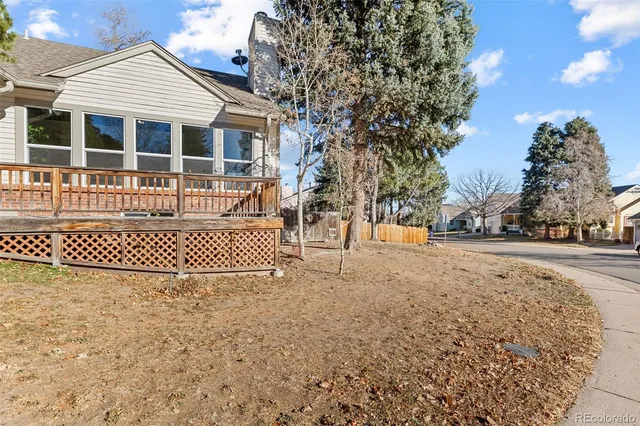 a view of wooden deck and a trees