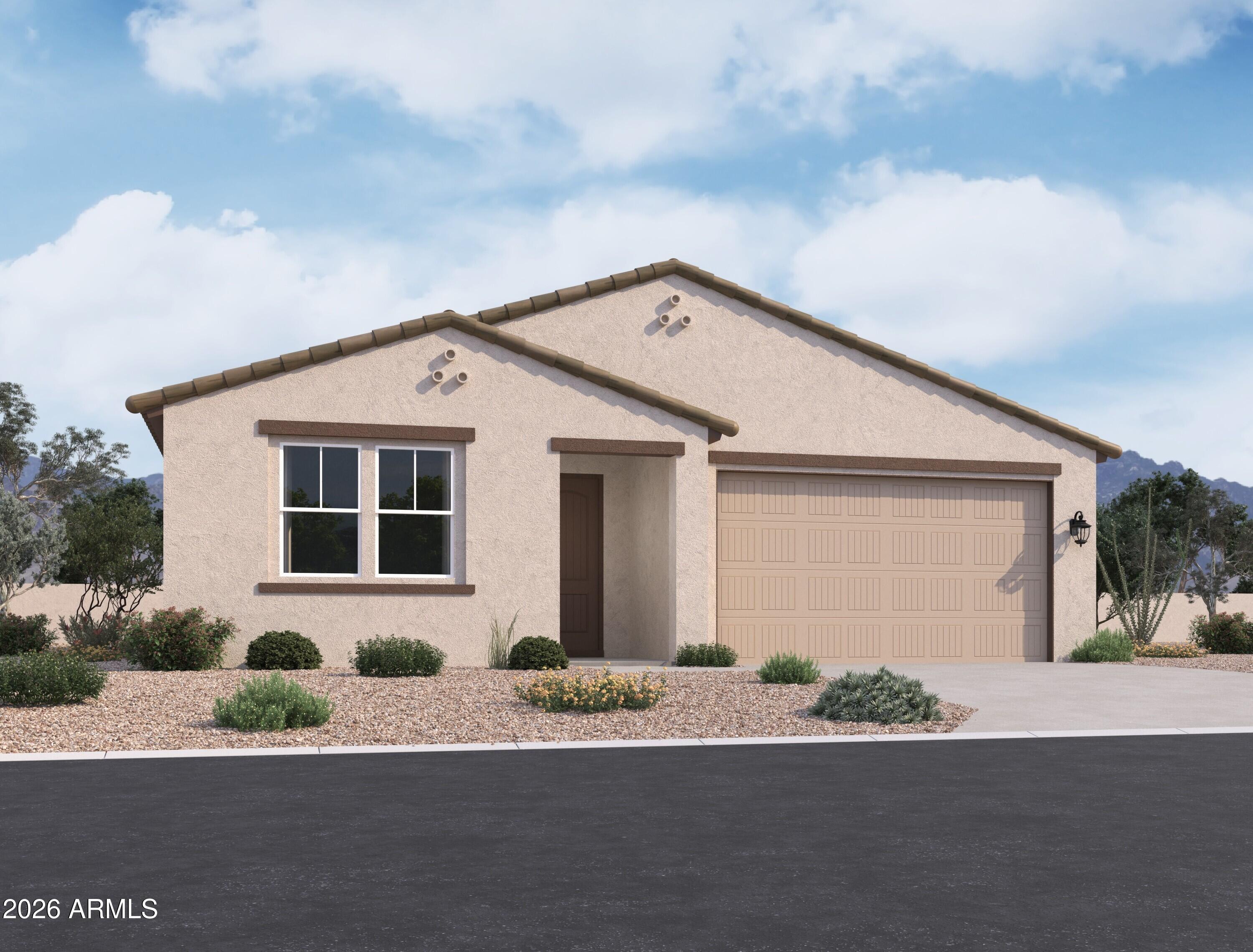 9540 West Gaby Road Tolleson, AZ 85353 - Photo 1 of 13 a front view of a house with a yard