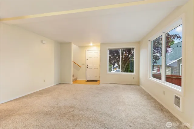 a view of a kitchen with a sink and cabinets