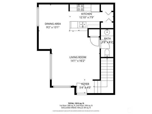 a picture of a bench in front of a wall