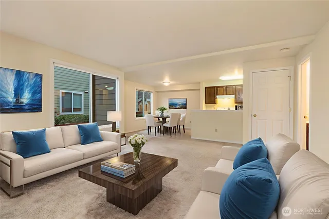 a bedroom with a bed and large windows