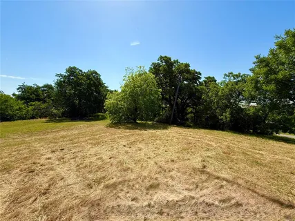 a view of empty yard with mountain