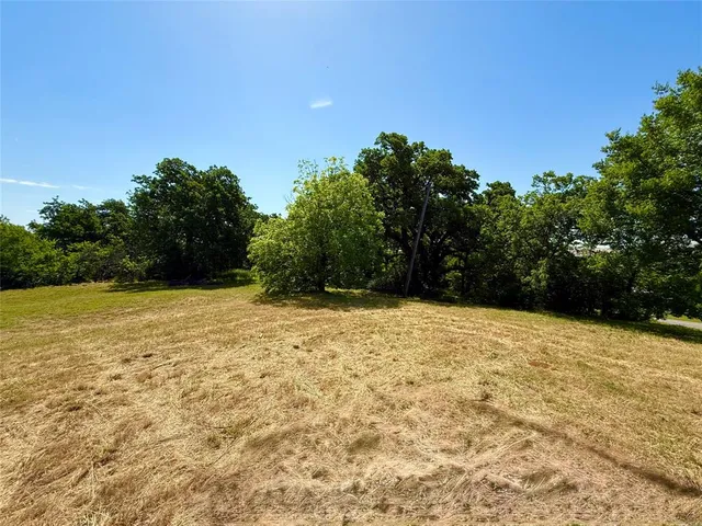 a view of empty yard with mountain