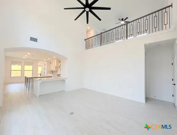 a view of room with window and furniture