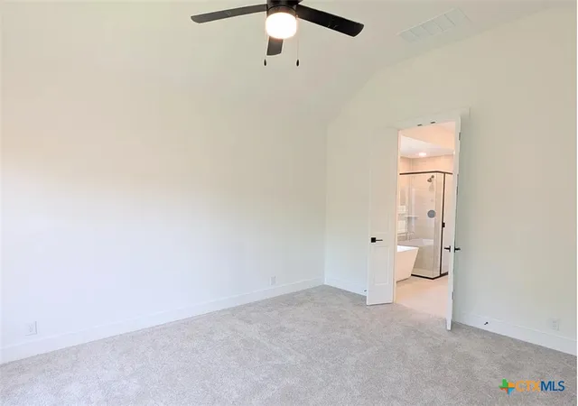 an empty room with a bathroom