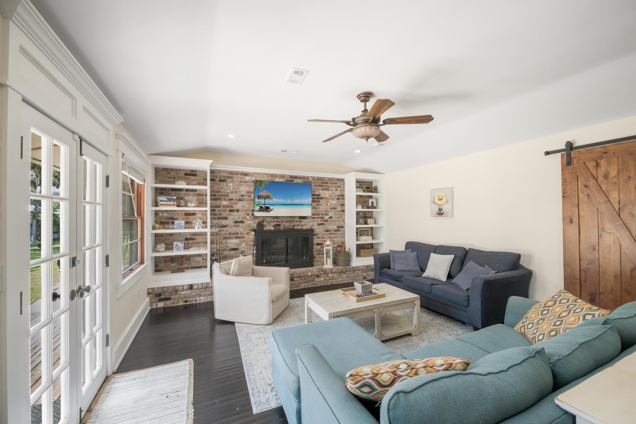 9 Menendez Road St. Augustine, FL 32080 - Photo 11 of 43 a living room with furniture a ceiling fan and a rug