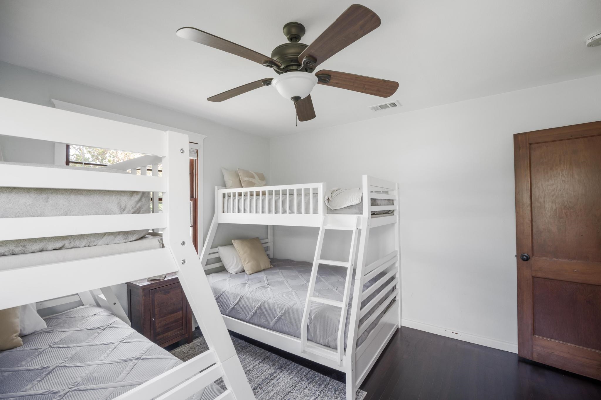 9 Menendez Road St. Augustine, FL 32080 - Photo 17 of 43 a bedroom with a bed and a chandelier