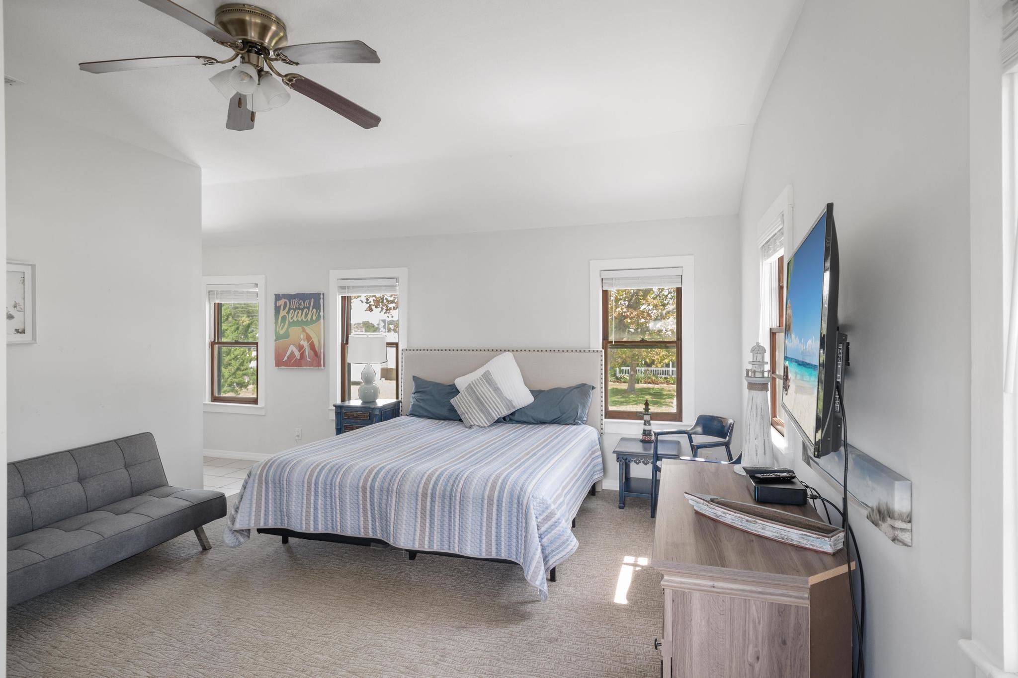 9 Menendez Road St. Augustine, FL 32080 - Photo 19 of 43 a bedroom with a bed flat screen tv and window