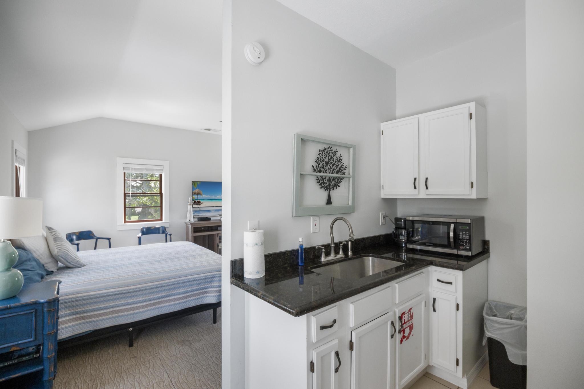 9 Menendez Road St. Augustine, FL 32080 - Photo 21 of 43 a bedroom with a bed and a night stand