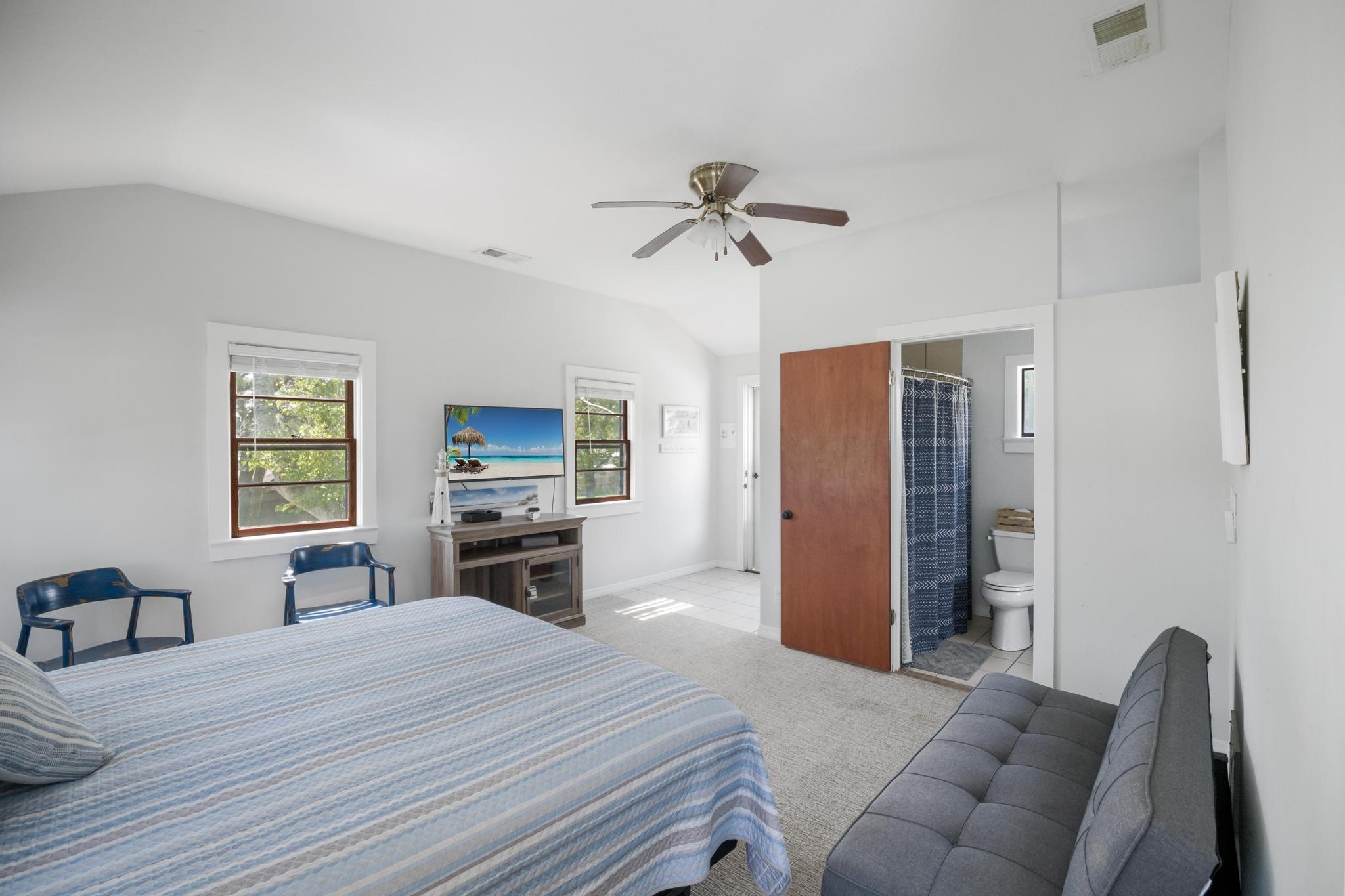 9 Menendez Road St. Augustine, FL 32080 - Photo 23 of 43 a bedroom with furniture and a flat screen tv