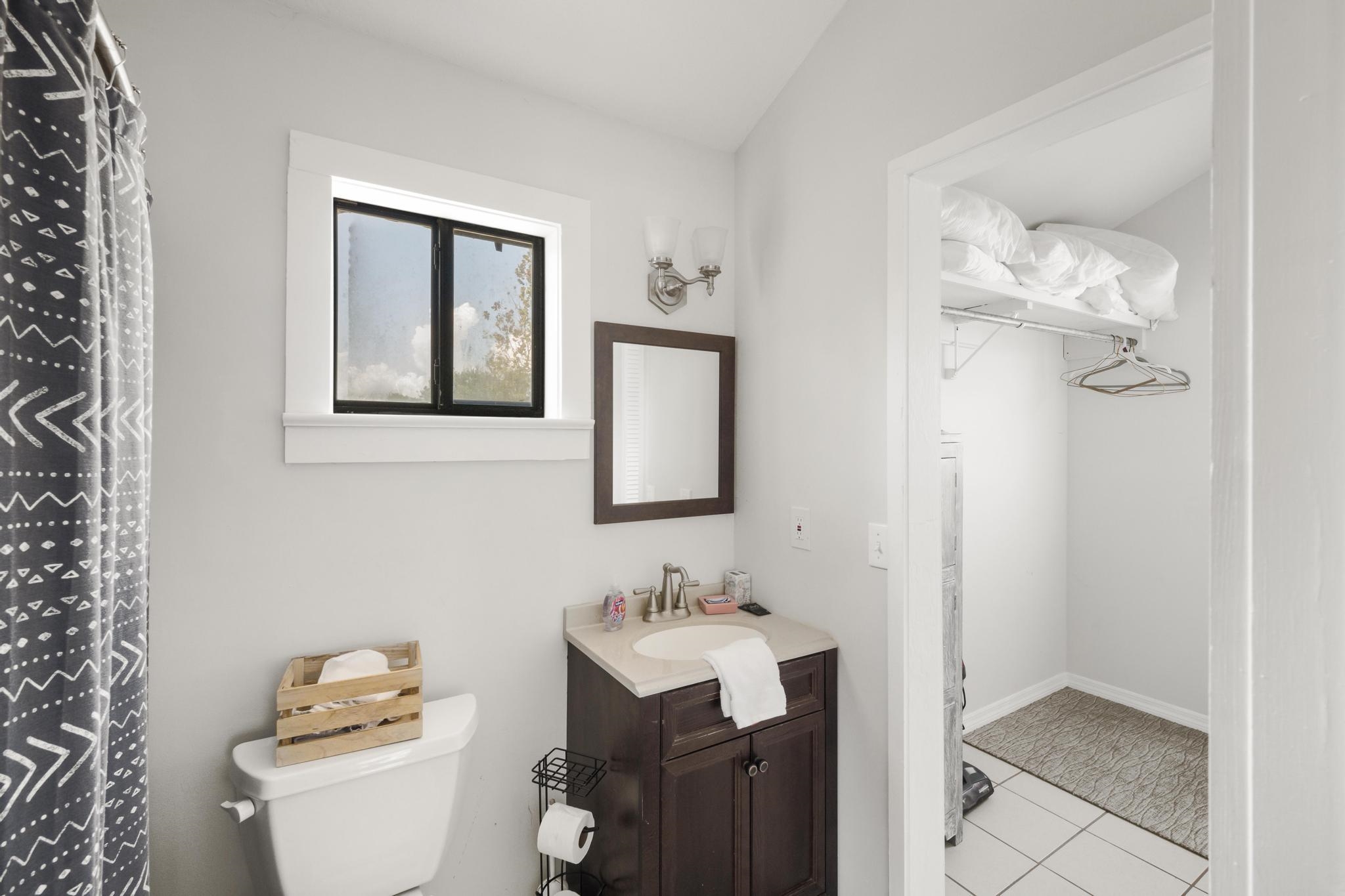 9 Menendez Road St. Augustine, FL 32080 - Photo 24 of 43 a bathroom with a sink vanity mirror and toilet