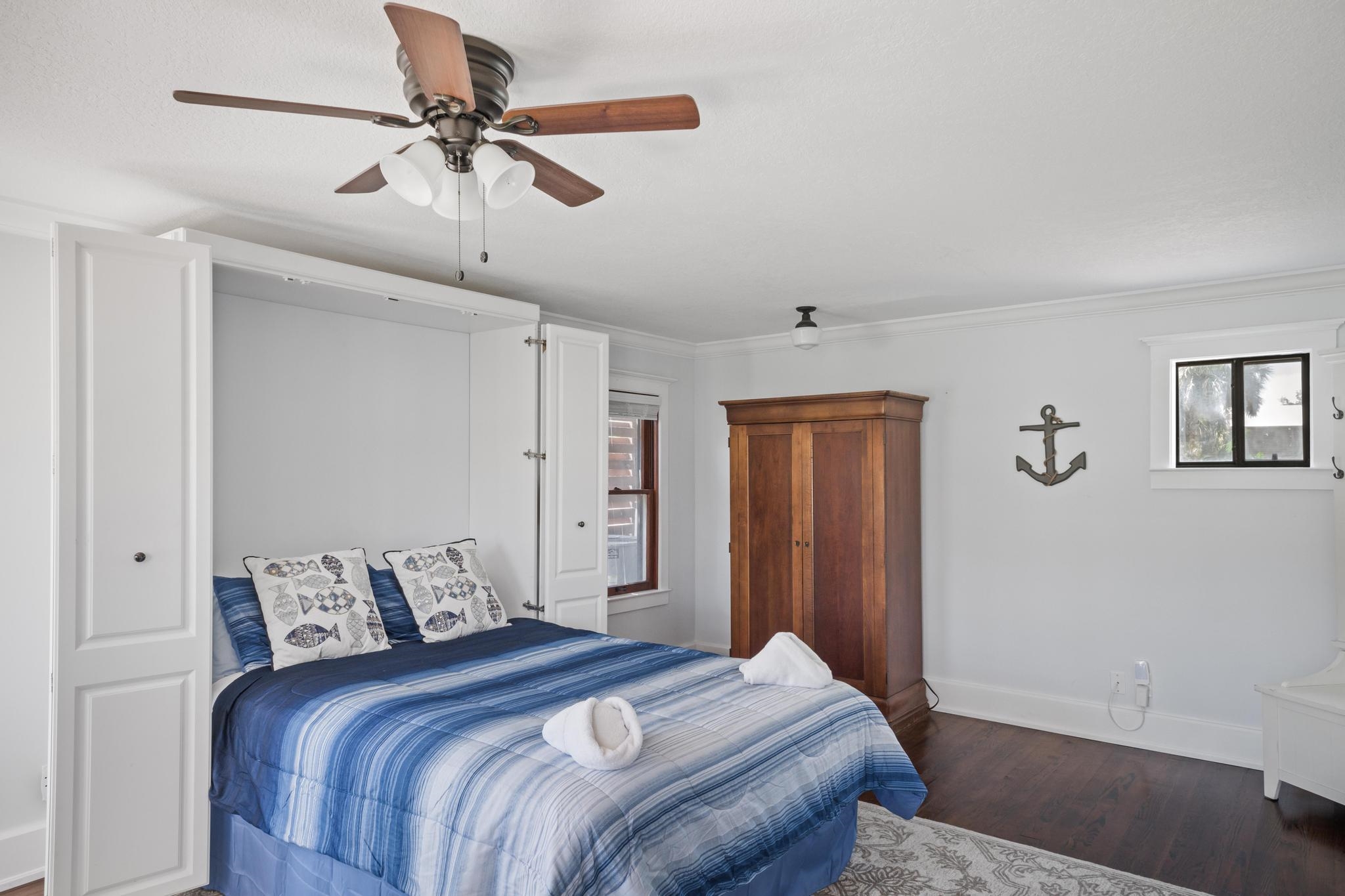 9 Menendez Road St. Augustine, FL 32080 - Photo 26 of 43 a bedroom with a bed and a walk in closet