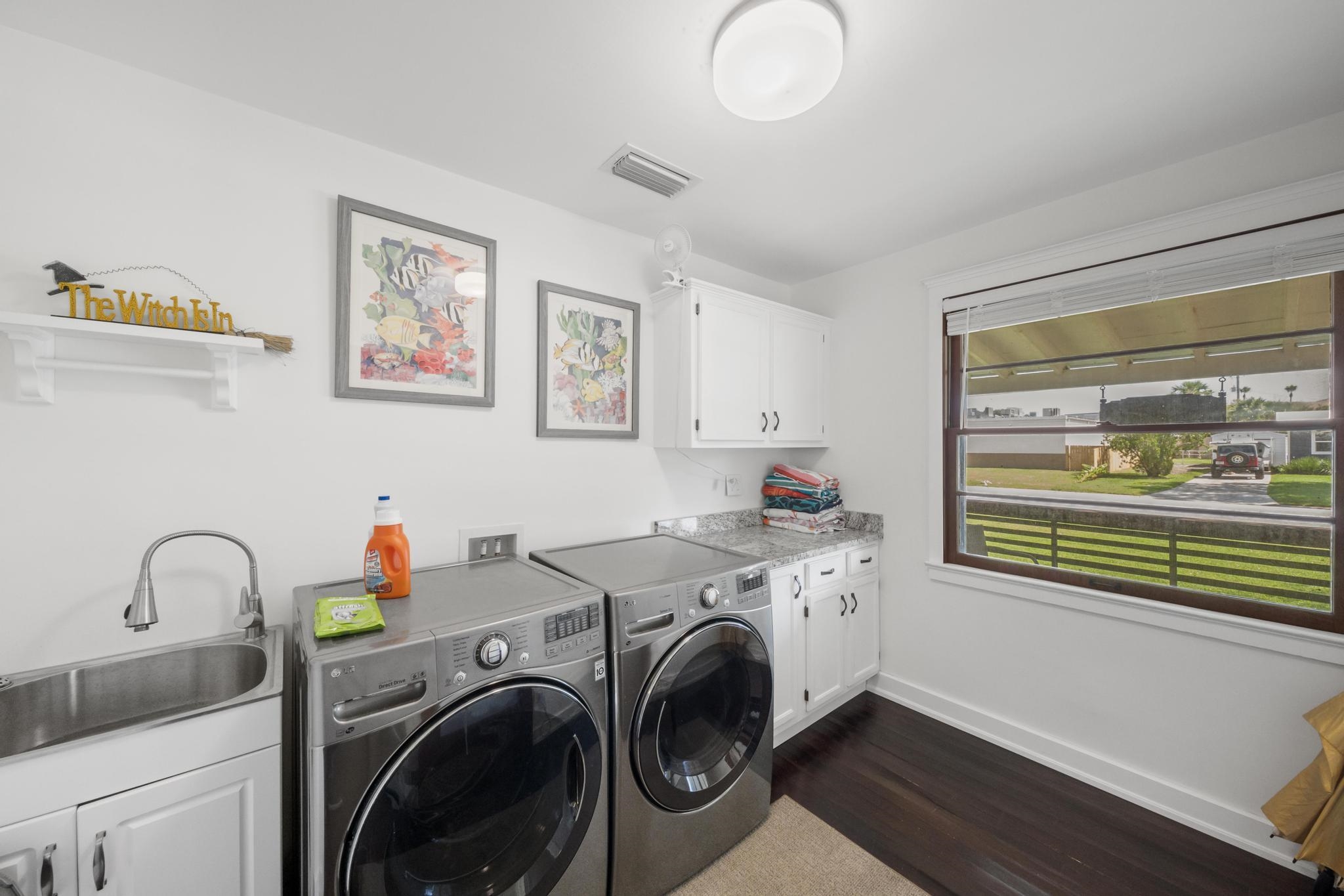 9 Menendez Road St. Augustine, FL 32080 - Photo 29 of 43 a utility room with dryer and washer