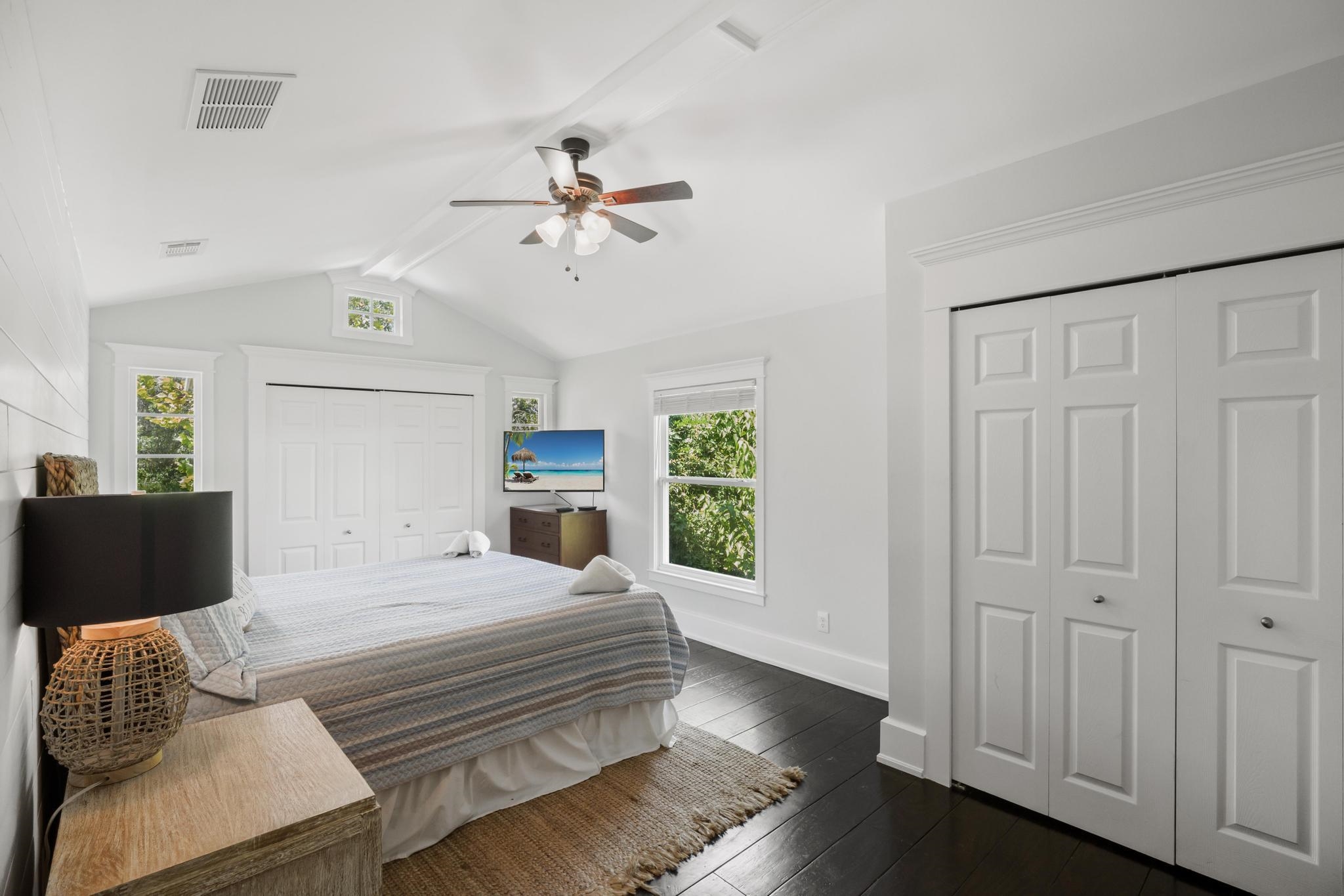 9 Menendez Road St. Augustine, FL 32080 - Photo 30 of 43 a bedroom with a bed and a chandelier