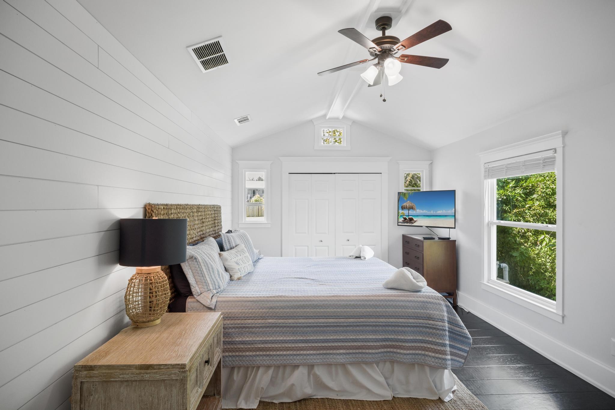 9 Menendez Road St. Augustine, FL 32080 - Photo 31 of 43 a bedroom with a bed and a chandelier