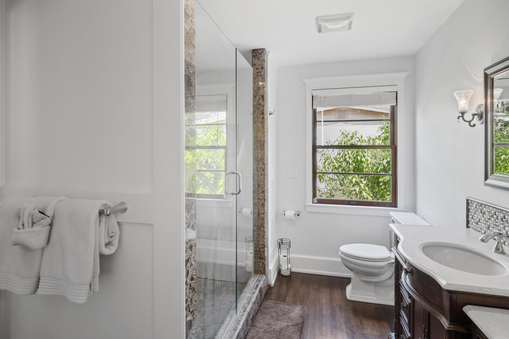 9 Menendez Road St. Augustine, FL 32080 - Photo 35 of 43 a bathroom with a toilet a sink and a mirror