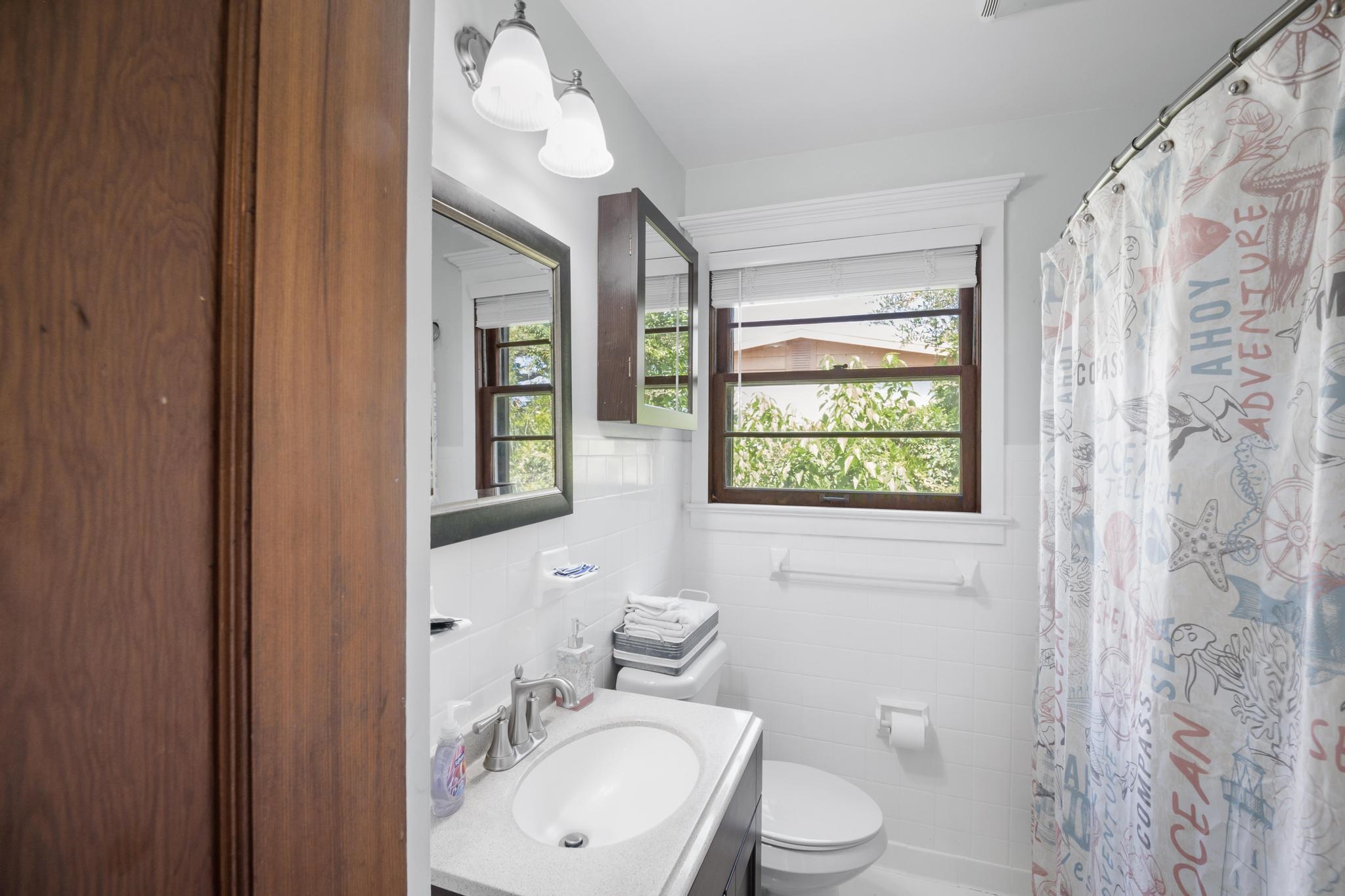 9 Menendez Road St. Augustine, FL 32080 - Photo 39 of 43 a bathroom with a toilet a sink and a window