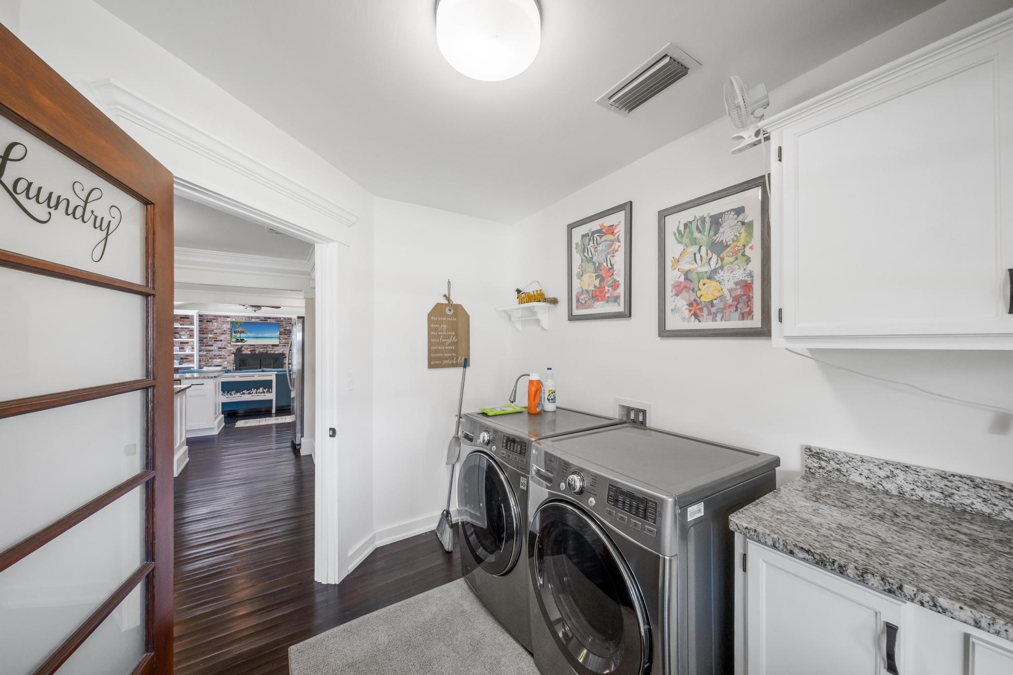 9 Menendez Road St. Augustine, FL 32080 - Photo 41 of 43 a utility room with sink dryer and washer