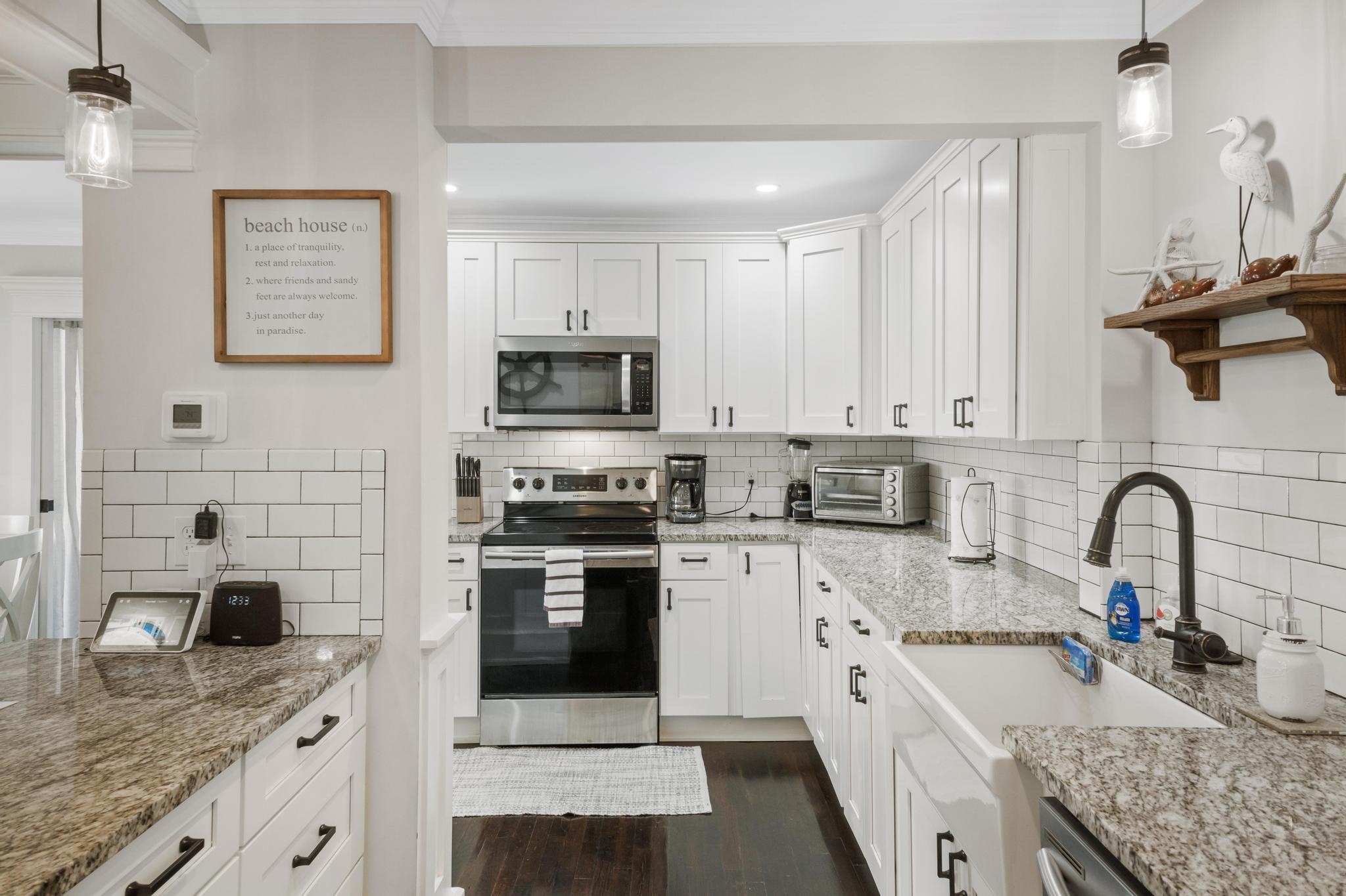 9 Menendez Road St. Augustine, FL 32080 - Photo 42 of 43 a kitchen with a sink stove and cabinets