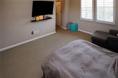2963 Walking Beam Place Brea, CA 92821 - Photo 13 of 25 a bedroom with furniture and a flat screen tv