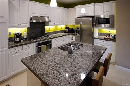 2963 Walking Beam Place Brea, CA 92821 - Photo 6 of 25 a kitchen with stainless steel appliances granite countertop a sink a stove and refrigerator