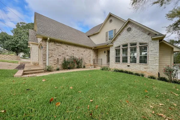 front view of a house with a yard