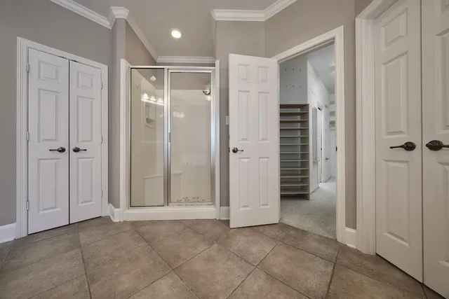 an empty room with closet area