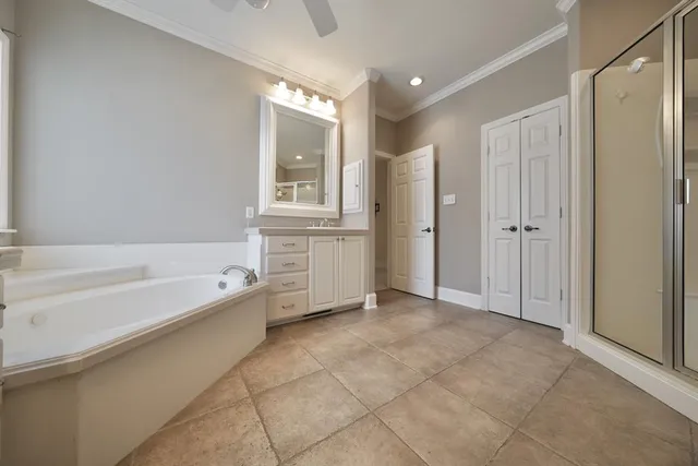 a spacious bathroom with a bathtub and a shower