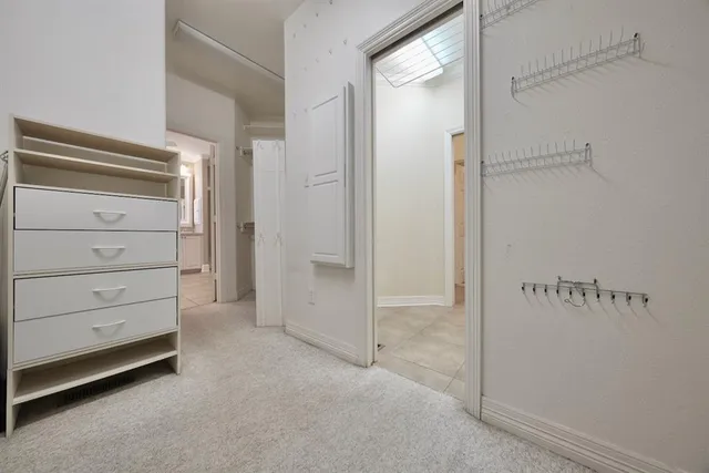 a view of an empty walk in closet
