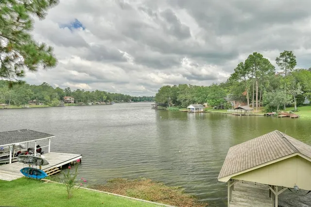 a view of a lake with houses in the back