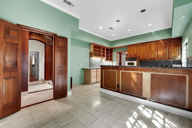 a kitchen with stainless steel appliances granite countertop a refrigerator and stove