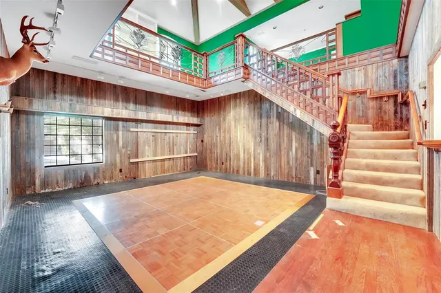 a bedroom with furniture and a large window