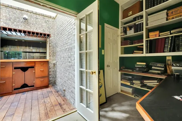 a bathroom with a granite countertop toilet a sink and a mirror
