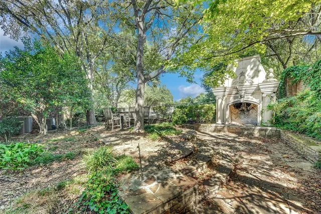 a backyard of a house with lots of green space