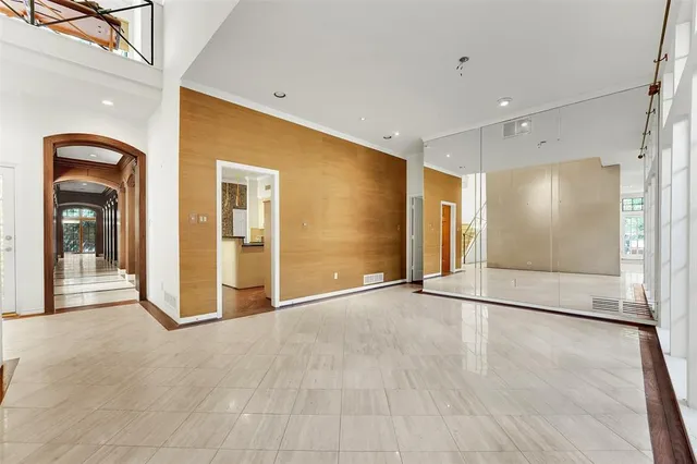 a view of an empty room with glass door