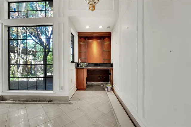 a view of a hallway with a outdoor space