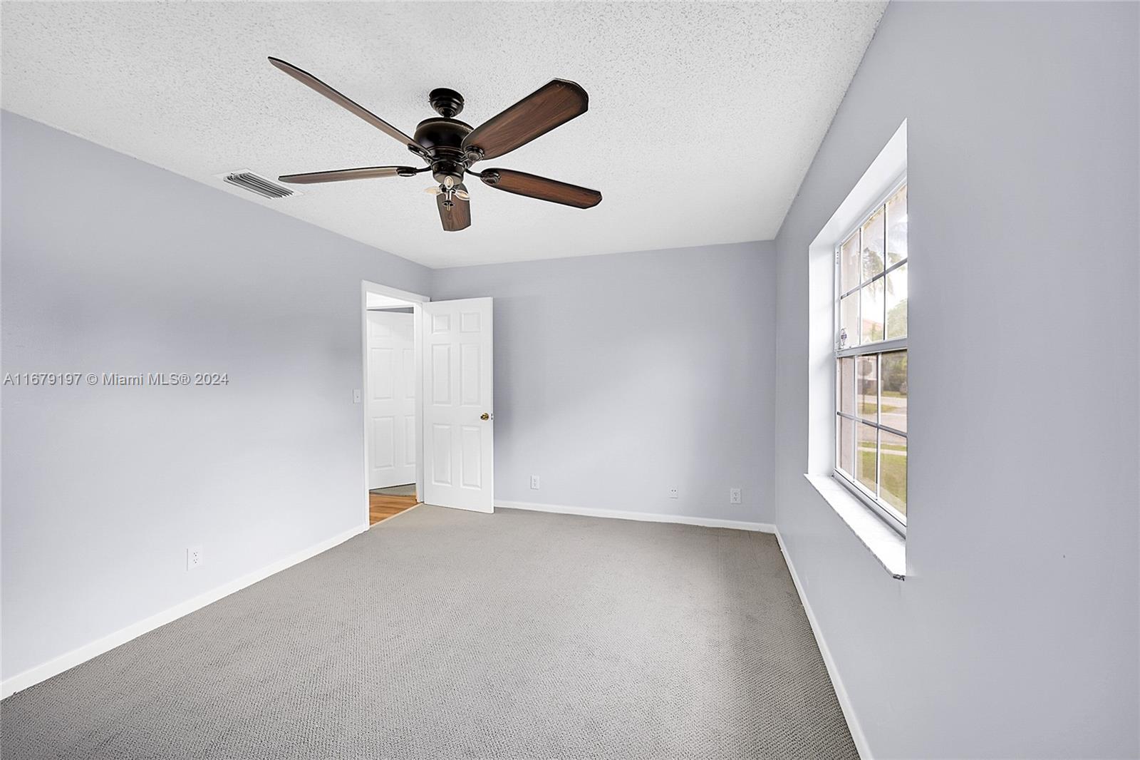 Greater Boynton Place Boynton Beach, FL 33437 - Photo 17 of 30 a view of an empty room with a window