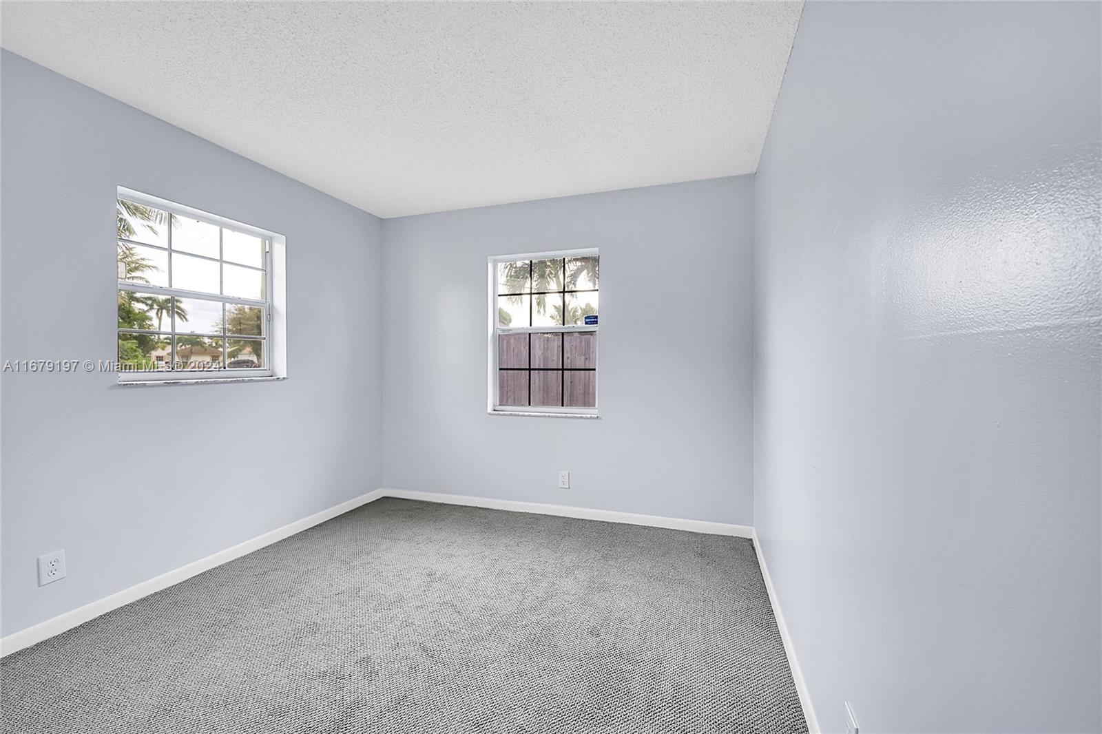 Greater Boynton Place Boynton Beach, FL 33437 - Photo 20 of 30 an empty room with windows