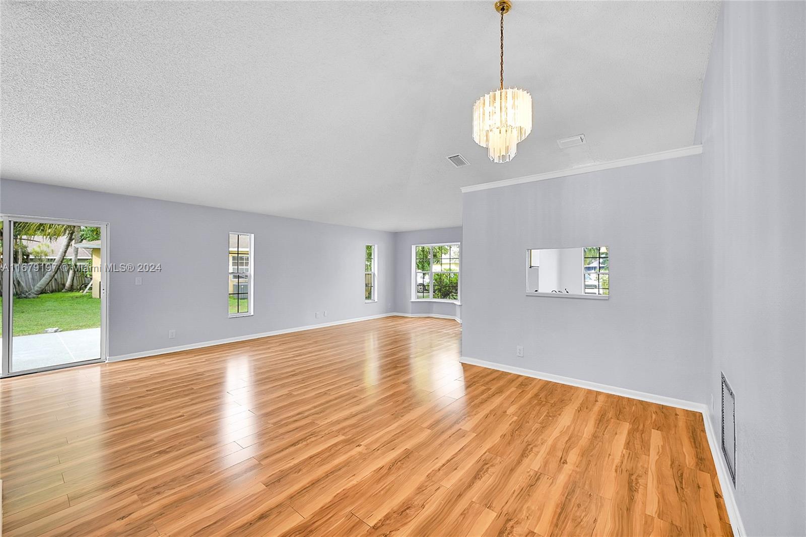 Greater Boynton Place Boynton Beach, FL 33437 - Photo 7 of 30 a view of a room with wooden floor and windows