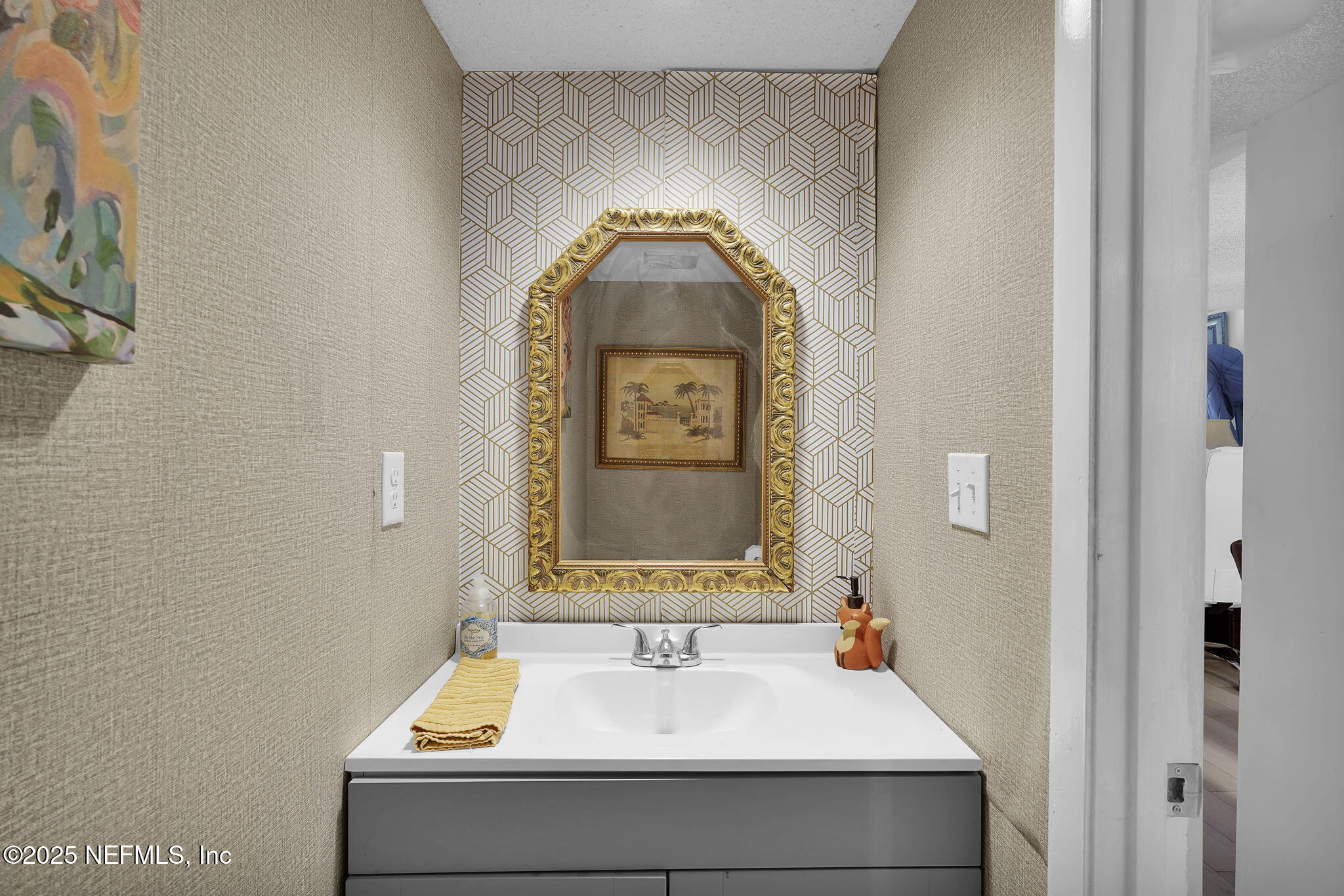 9901 Regency Square Boulevard, Unit 90 Jacksonville, FL 32225 - Photo 12 of 27 a bathroom with a sink and a mirror