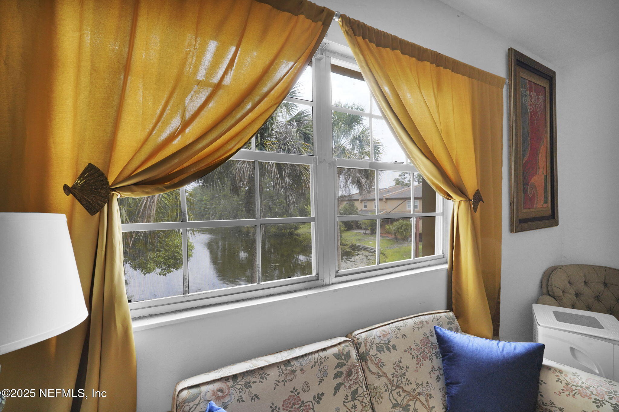 9901 Regency Square Boulevard, Unit 90 Jacksonville, FL 32225 - Photo 16 of 27 a view of a window in a living room