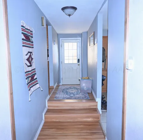 a view of a hallway with a white walls